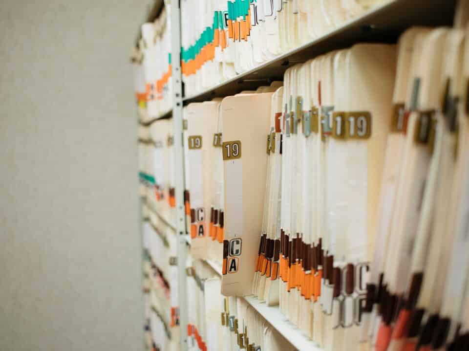 medical record charts on shelve sorted alphabetically